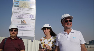 Beginning of construction of the uSky Center in Sharjah, UAE. Anatoli Unitsky (on the right) in front of the facility passport