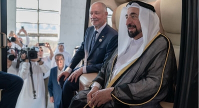 The governor of Sharjah, Sheikh Sultan bin Mohammed Al-Qasimi, and Anatoli Unitskiy in the interior of tropical uCar. The uSky Center
